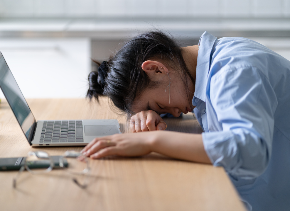 Manufacturing Job Search Burnout: How to Stay Motivated and Focused. Woman burnt out from job search.