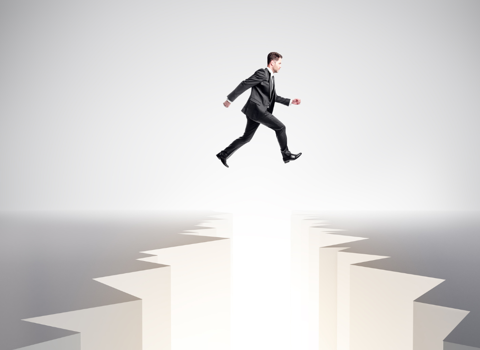 Man in a suit, physically jumping a career gap