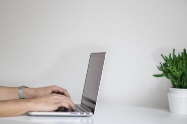 hands typing a LinkedIn profile